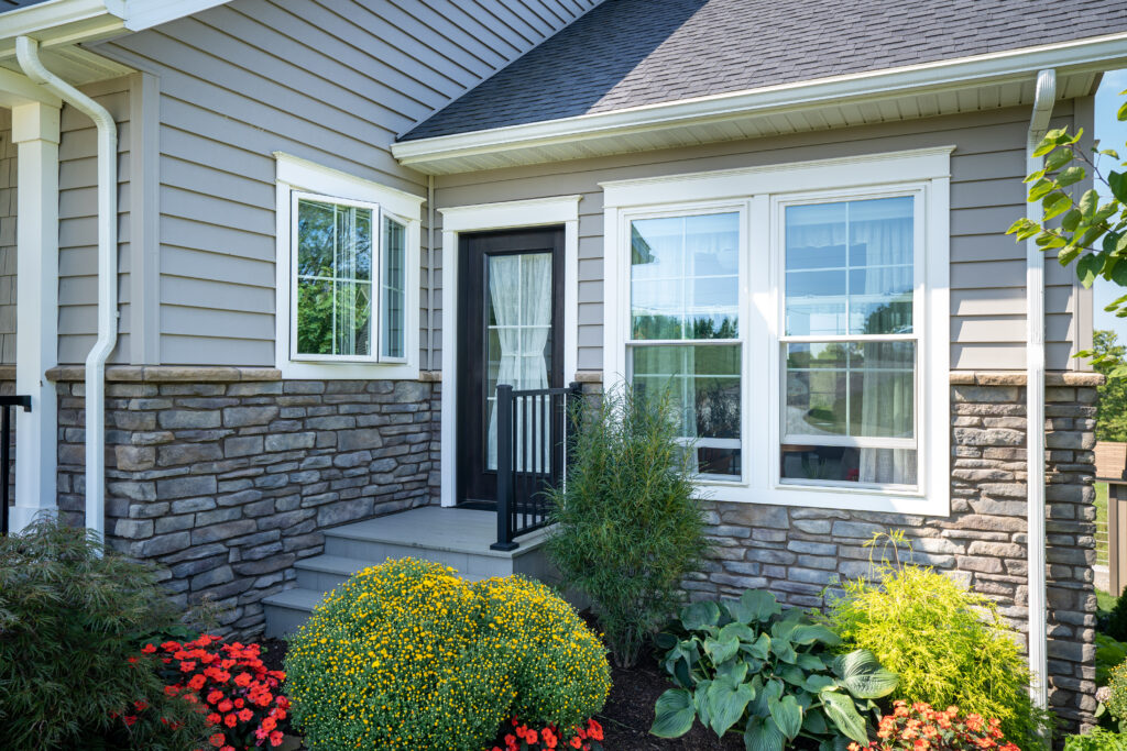 Home exterior with a ProVia entry door and OKNA windows. Windows and doors installed by Window Universe Cleveland.