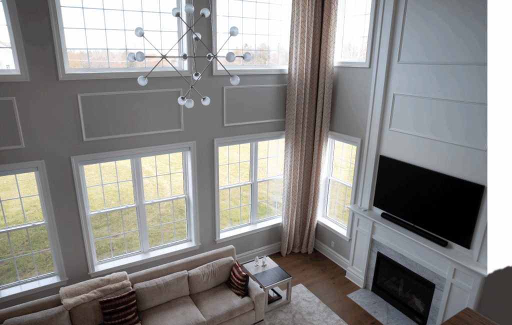 Okna vinyl replacement windows in a Cleveland living room Double-hung vinyl window with white frame and tilt feature