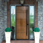 8-foot ProVia Signet Cherry entry door in Natural Bark stain with long square pull handle and decorative sidelites, installed on a Cleveland-area home
