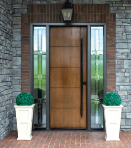 8-foot ProVia Signet Cherry entry door in Natural Bark stain with long square pull handle and decorative sidelites, installed on a Cleveland-area home