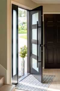 ProVia Signet Smooth entry door in Coal Black with frosted privacy glass and black Emtek vertical pull handle, installed in a Cleveland home
